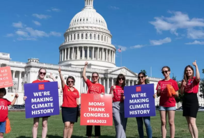 A group of moms celebrate the passage of the Inflation Reduction Act, the biggest climate bill in U.S. history.