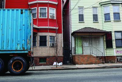 Trucks are seen driving through the Ironbound district near the intersection of Hawkins St. and Ferry St. in Newark, in Newark, NJ, on November 18, 2015. The rise in truck and port traffic has prompted residents and environmental groups to demand that the EPA does more to protect people from the resulting increase in smog.