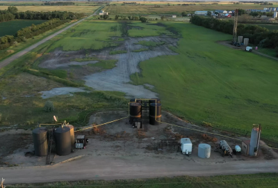 Oil slick spreading over green farmland in North Dakota