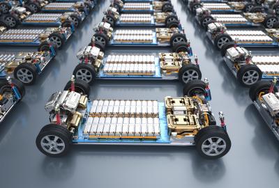A row of car frames with batteries lined on the bottom