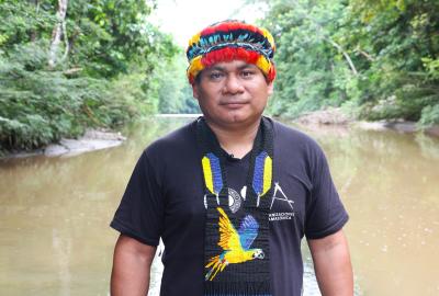 Tuntiak Katan standing in front of a river