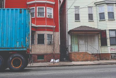 Trucks are seen driving through the Ironbound district near the intersection of Hawkins St. and Ferry St. in Newark, in Newark, NJ, on November 18, 2015