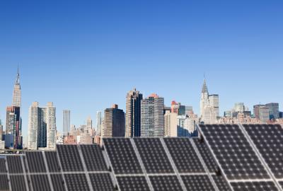 Solar panels in the foreground with the Manhattan skyline in the background