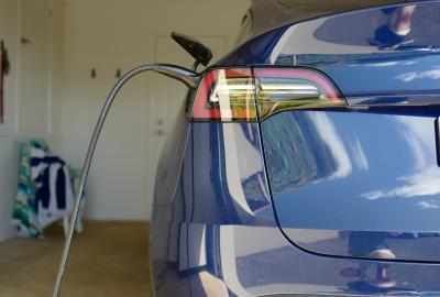 An electric car plugged in in a garage 