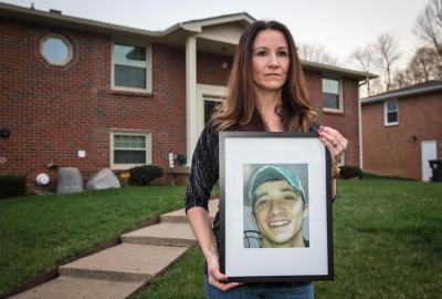 Wendy Hartley holding a picture of her son