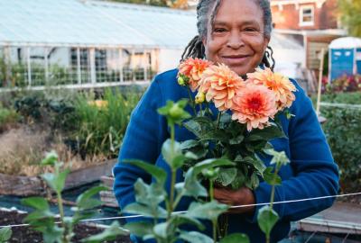 Mimo Davis holding freshly cut flowers