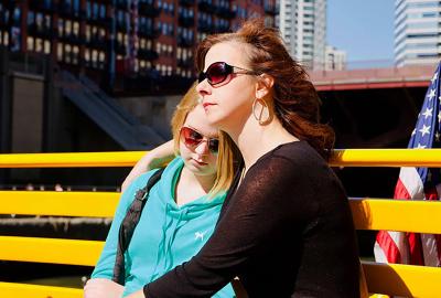 Kari Rhinehart and her daughter Emma Grace Findley sitting on a bench