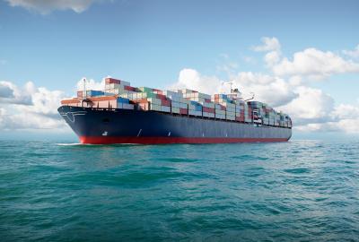 A large ship with shipping containers on it at sea