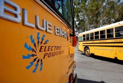 A yellow school bus with "electric powered" on the side