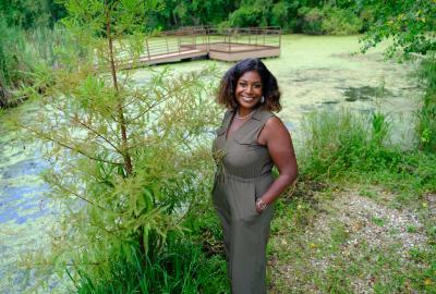 Rashida Ferdinand standing near a wetland