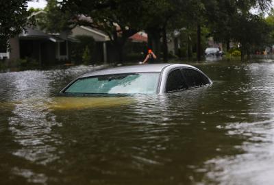 A car underwater on a residential street