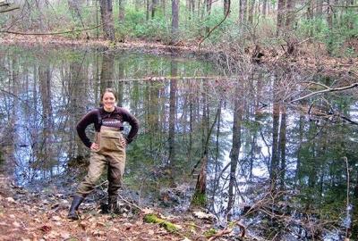 Meredith Holgerson standing in front of a pond