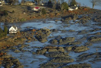 A large-scale environmental disaster scene caused by a massive spill or flood of industrial waste
