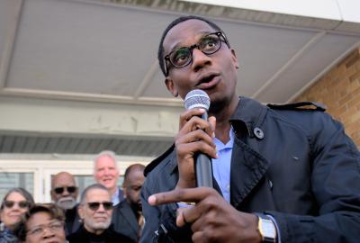 Cleveland's mayor Justin Bibb speaking into a microphone