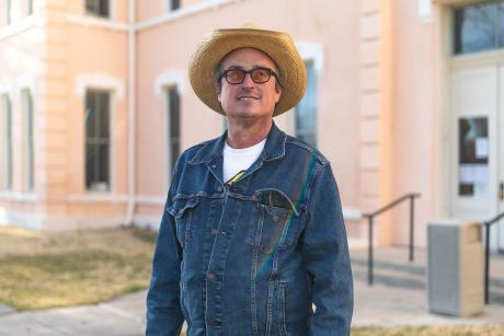 David Beebe standing in front of the Marfa Courthouse