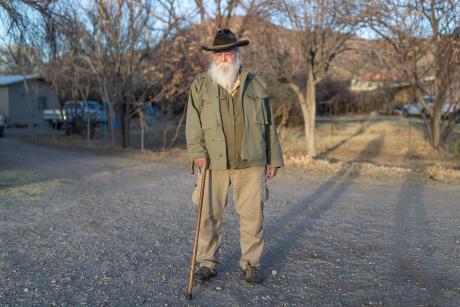 Randall Cater standing in front of his home 