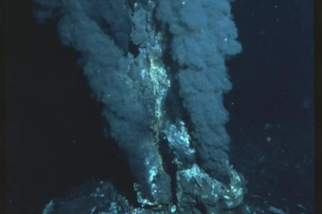 A hydrothermal vent erupting at the bottom of the ocean