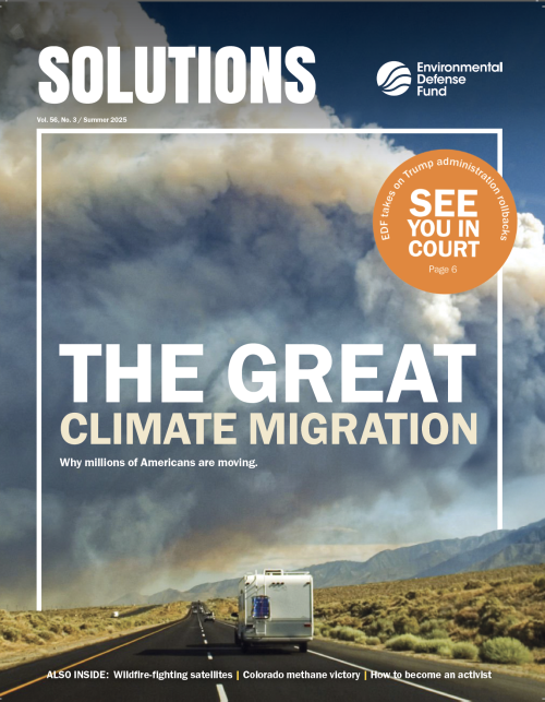 The summer 2025 issue of Solutions with The Great Climate Migration as the cover story as an RV drives down a road while white smoke covers most of the horizon