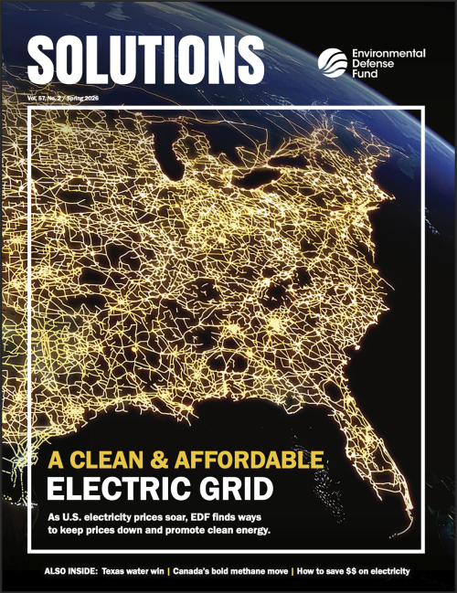 The cover of Solutions magazine where a shot of the U.S. from space shows electrical grid with the cover story "A clean and affordable electric grid"