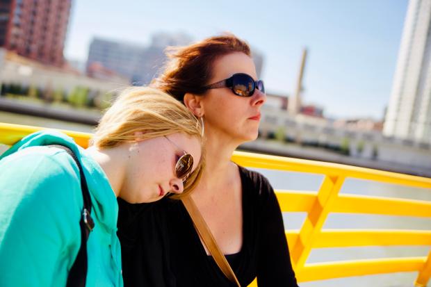 Kari Rhinehart and her daughter Emma Grace sitting on a bench