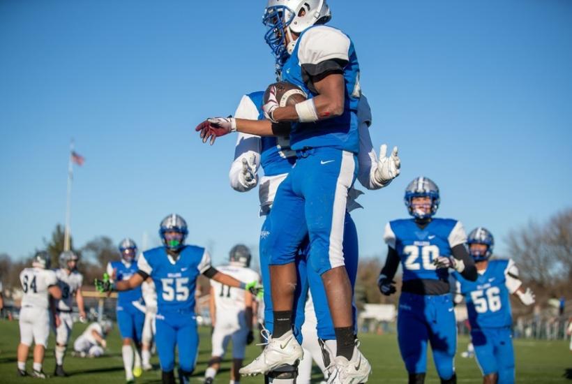 Football players jumping in celebration