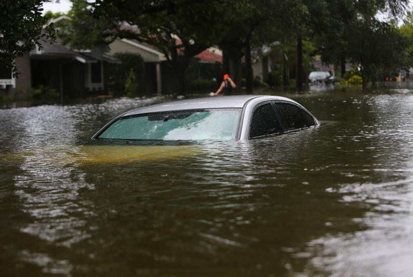 A car underwater on a residential street